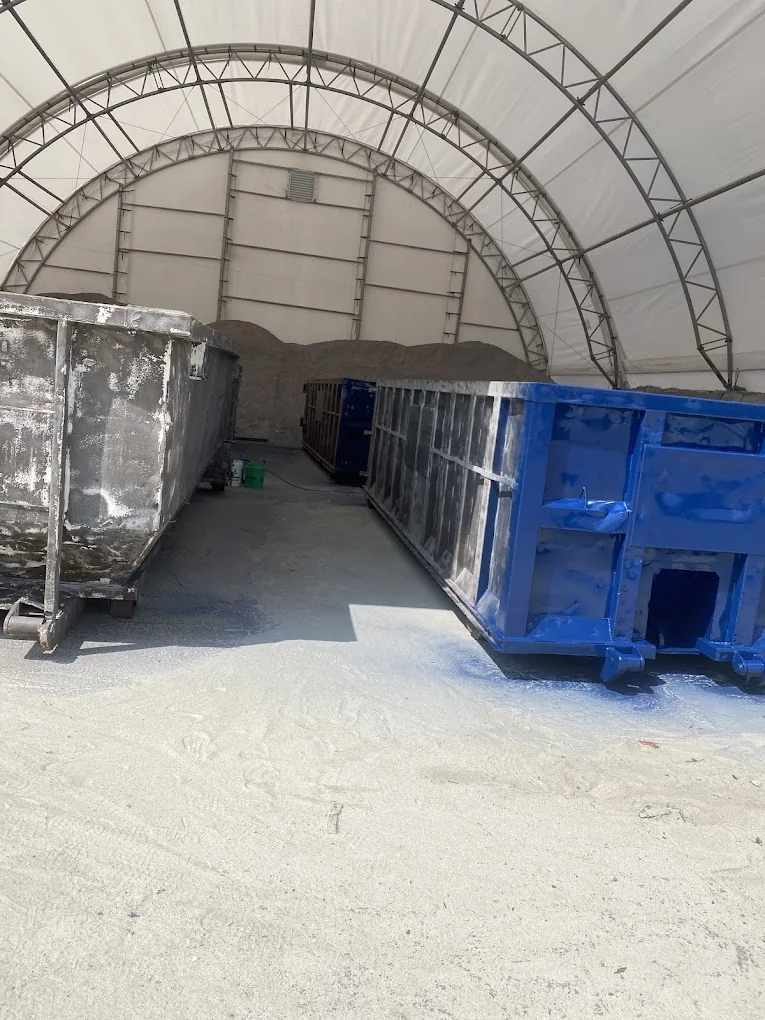 Commercial metal dumpster coating project in progress