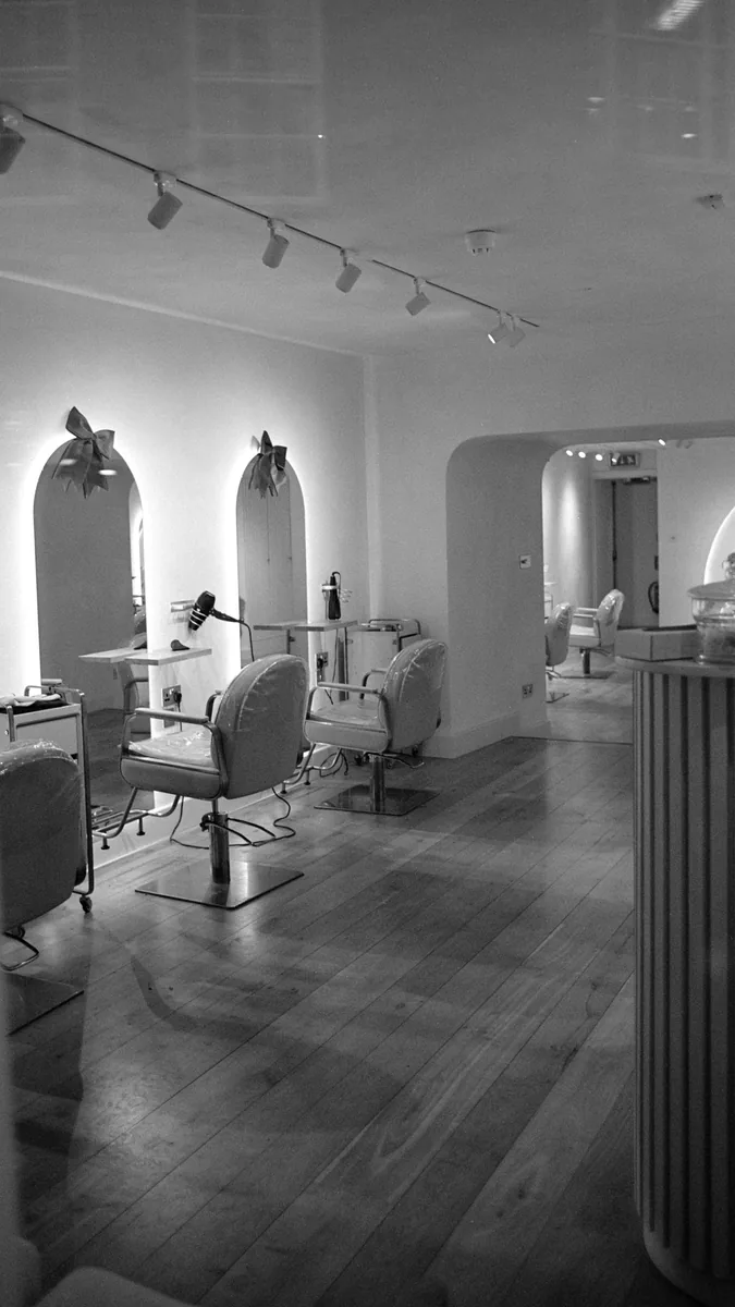 Modern hair salon interior with chairs and mirrors